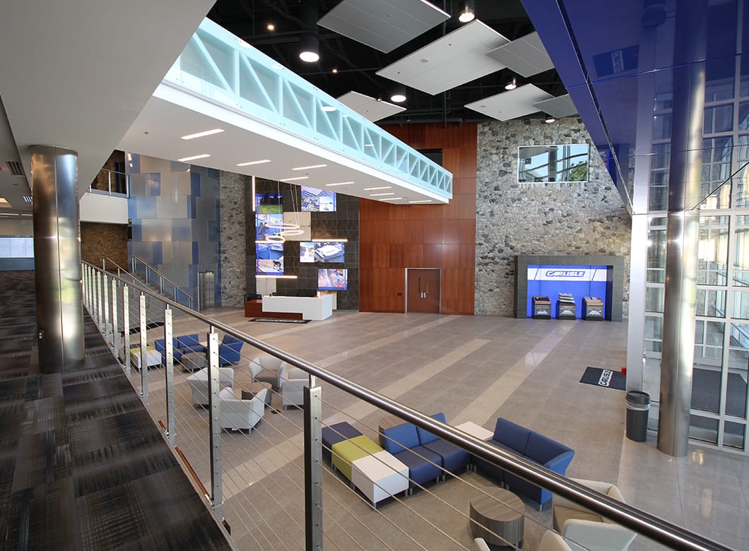 A wide view of the reception hall at CCM Training and Education Centre, featuring Archetype Glass' custom laminate glass wall cladding