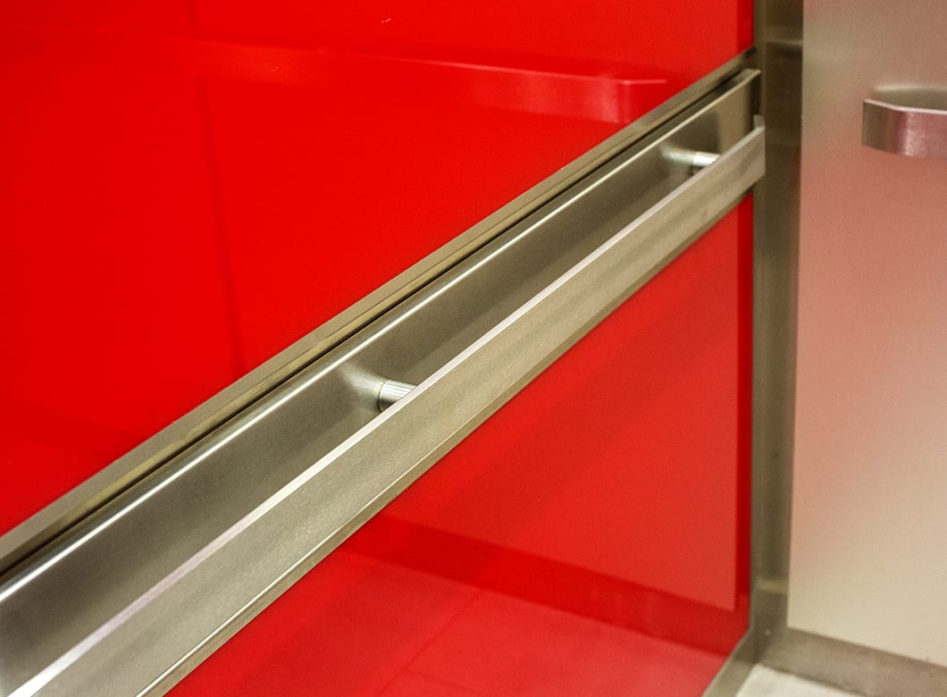 A detailed view of the custom glass elevator cab cladding for the Cambria Hotel Washington, D.C. Convention Center, by Archetype Glass