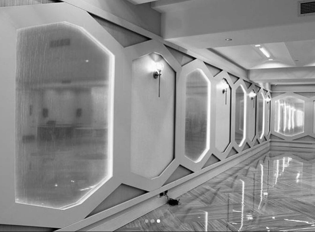 A detailed view of the custom laminated art glass wall cladding for the Spruce Street Synagogue, created by Archetype Glass