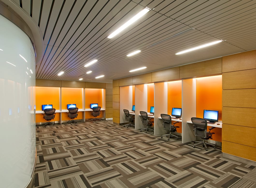 Archetype Glass' custom laminated art glass wall cladding at the Gates Vascular Institute, crafted by Archetype Glass