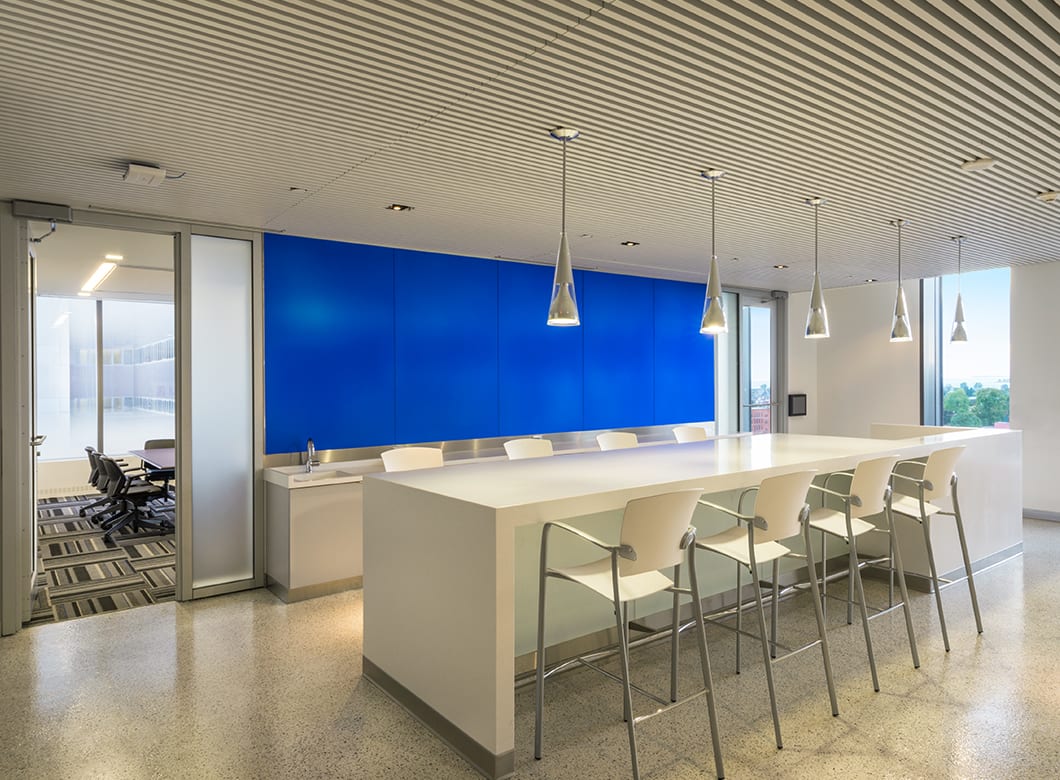 Alternate wide view of the custom laminated glass wall cladding at the Gates Vascular Institute, by Archetype Glass