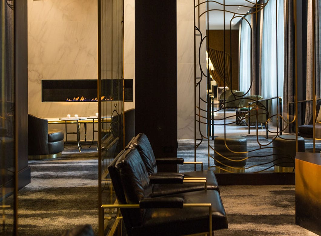 A wide view of the elegant custom art glass partition walls at the Kimpton Hotel Allegro, crafted by Archetype Glass