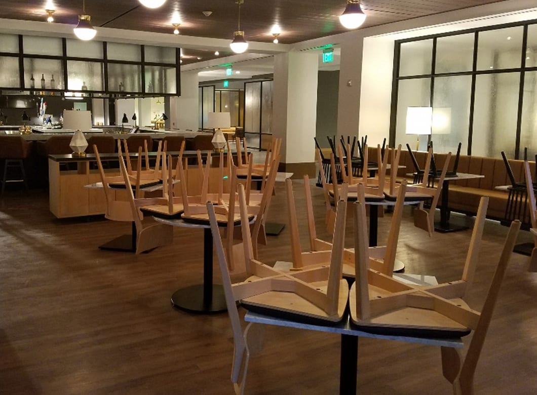 A wide view of the restaurant in the Verizon Basking Ridge Hotel Bar, featuring Archetype Glass' custom frosted glass partition walls